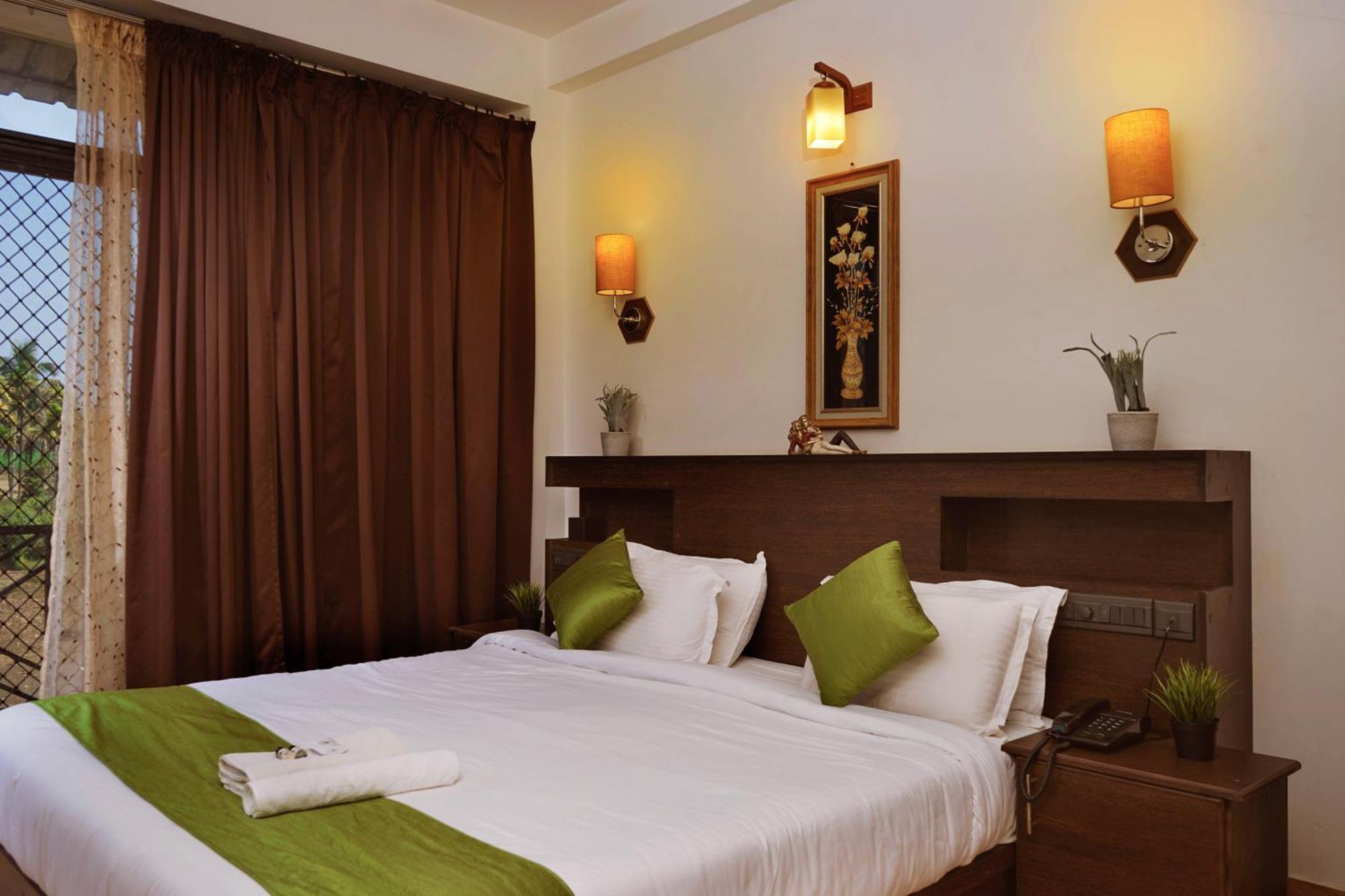 مانانثافادي Paddyfield Inn الغرفة الصورة